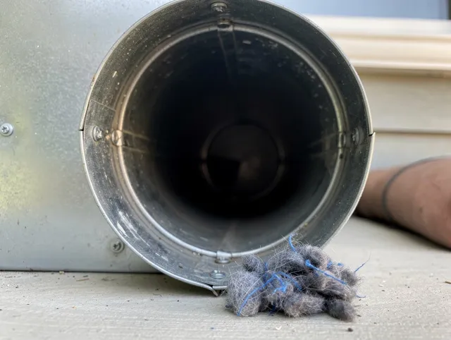 Glendale Dryer Vent Cleaning technician using specialized equipment to clear severe dryer vent blockage in Glendale